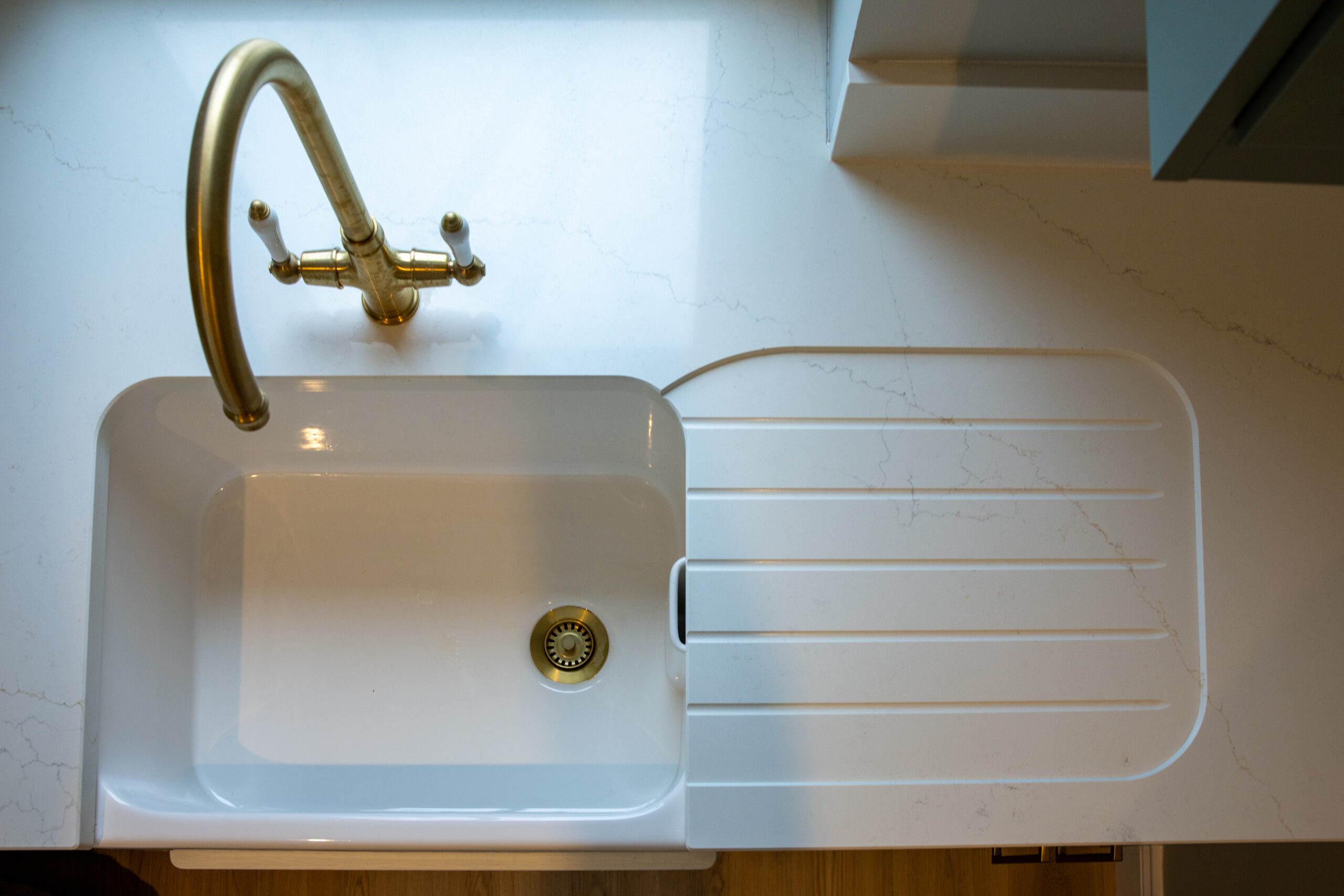 Wide angle of kitchen showcasing Muse by Casla across island and runs